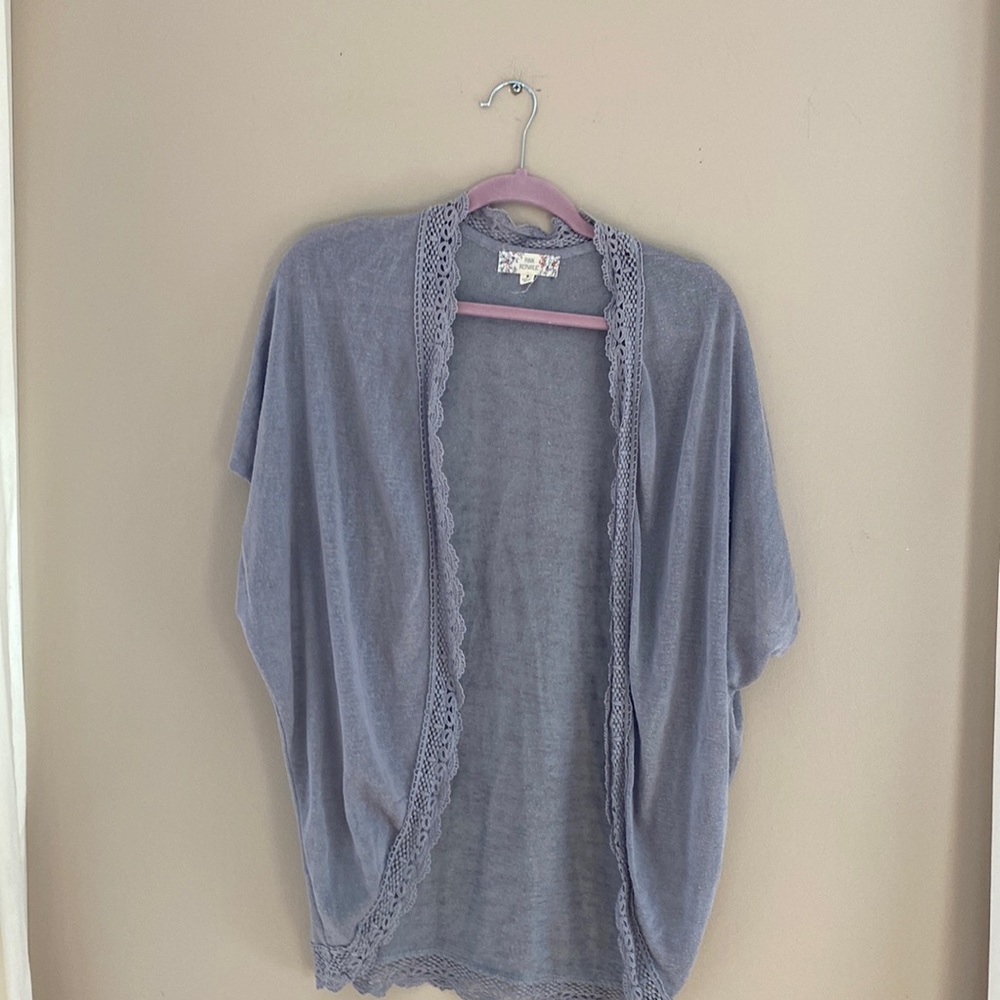 Soft grey short sleeve cardigan.